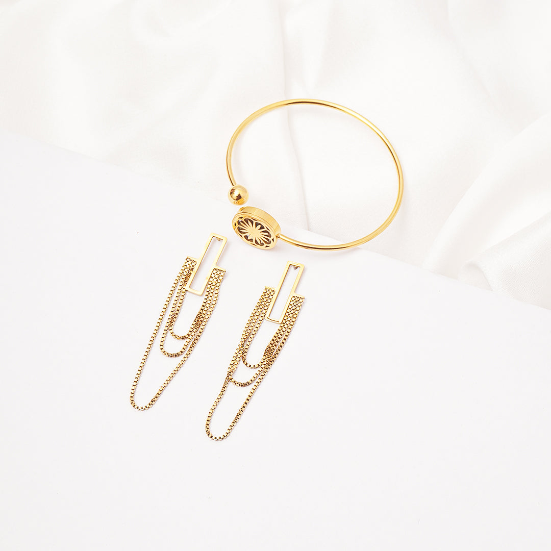 Gold hoop earring with chain extensions on a white background