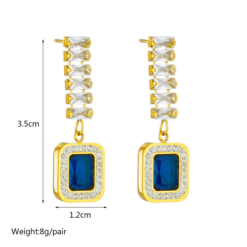 gold tone blue crystal statement earrings