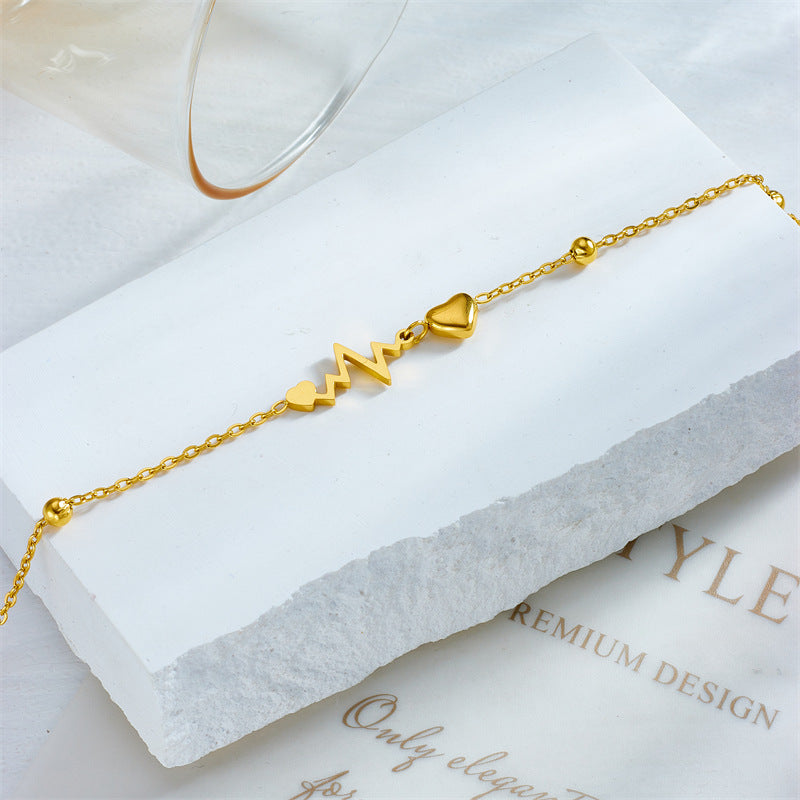 gold heart charm bracelet
