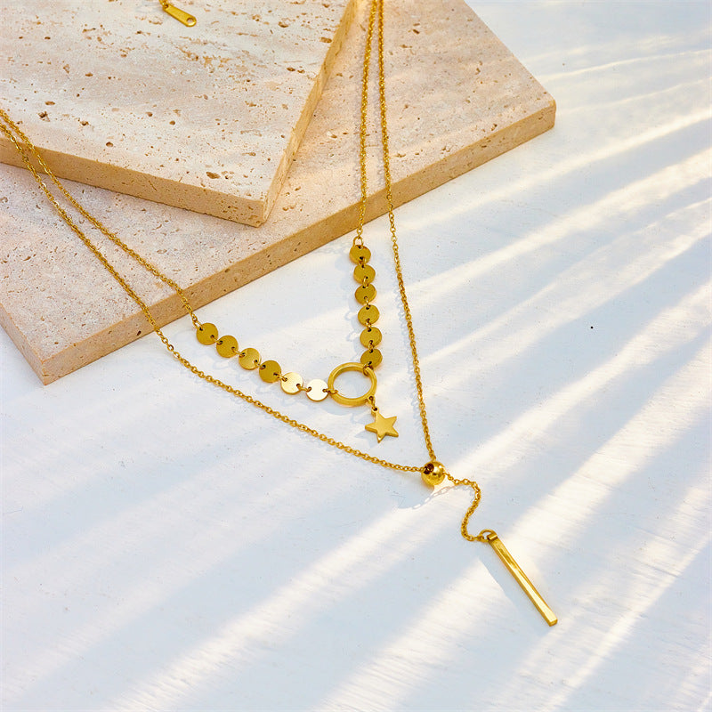 pearl and gold charm layered necklace