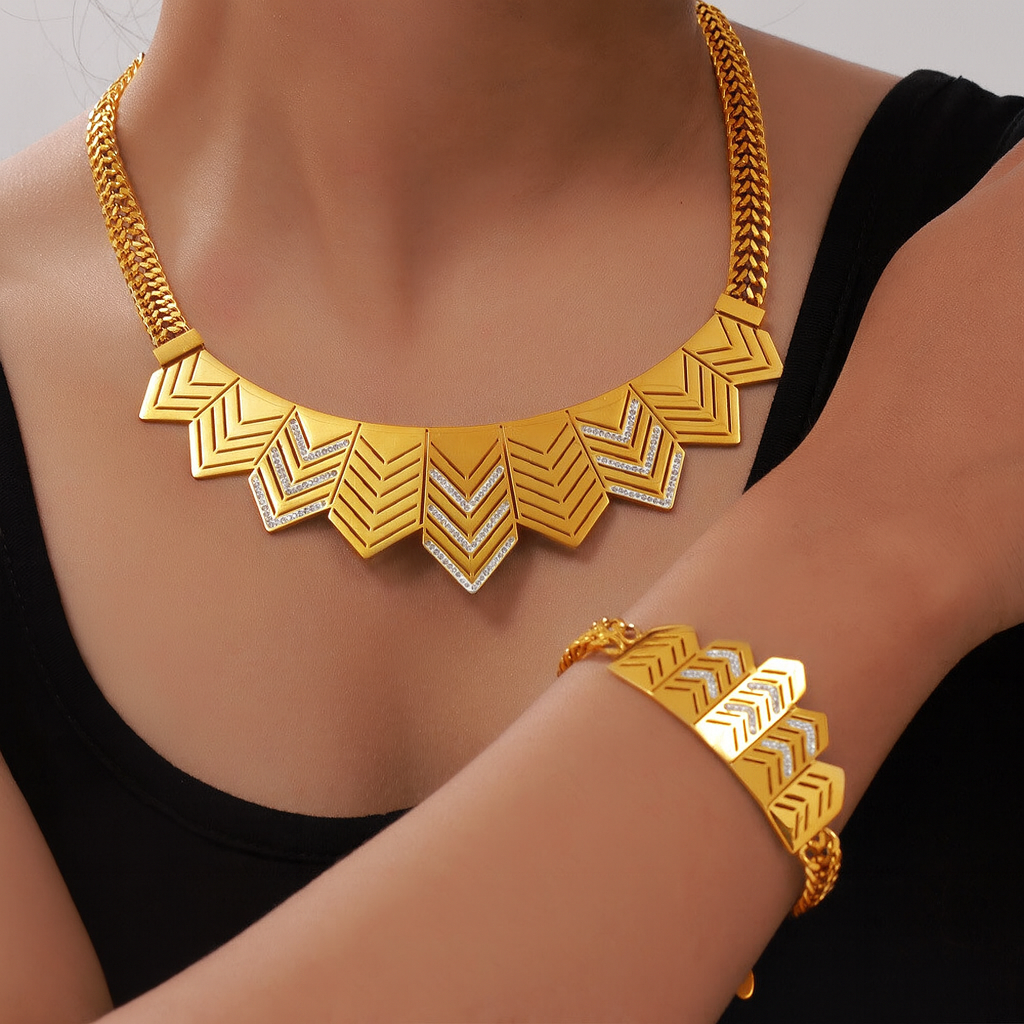 Gold necklace with geometric design on a beige stand