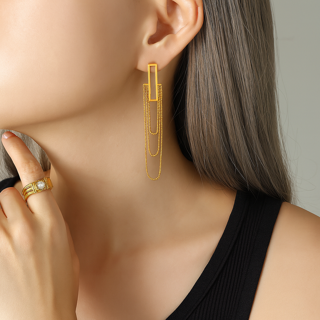 overlapping link gold earrings close view