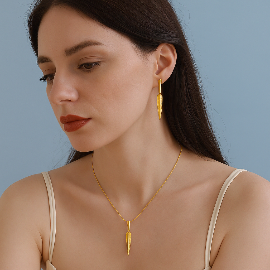 Woman wearing gold earrings and necklace against a blue background